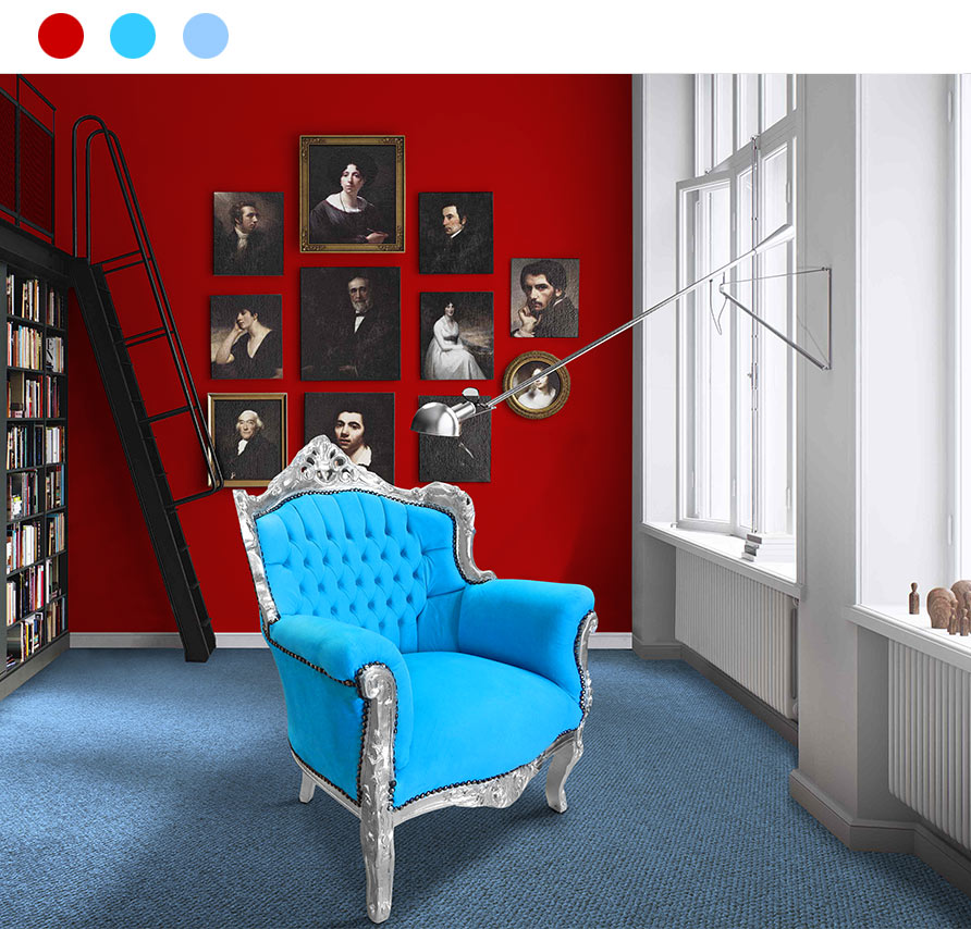 large turquoise baroque armchair in a bright red and blue environment